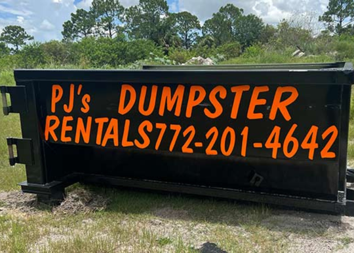 About PJ Trucking & Land Clearing - A dumpster rental set on someone's property.